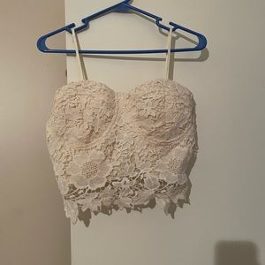 Knit cream colored bustier top.